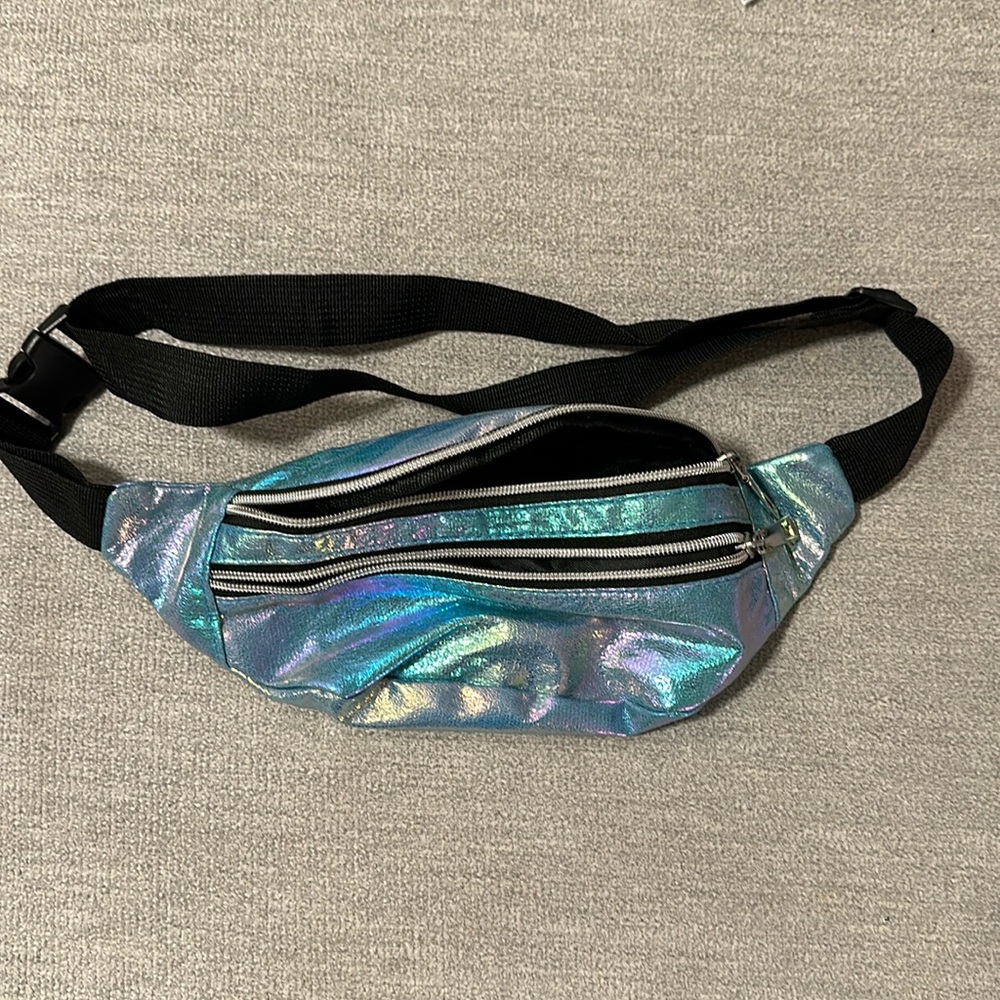 Multi color Fanny pack with black strap. Used one time